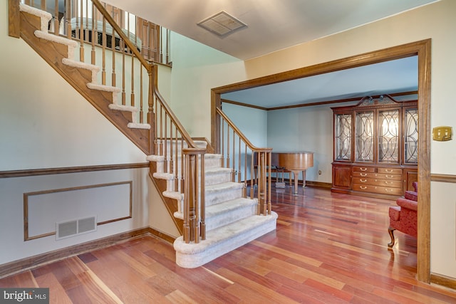 staircase featuring hardwood / wood-style floors