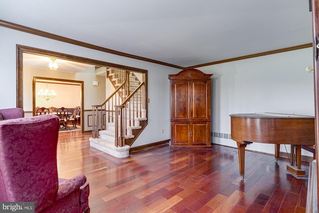 interior space featuring crown molding, dark wood-type flooring, and a notable chandelier