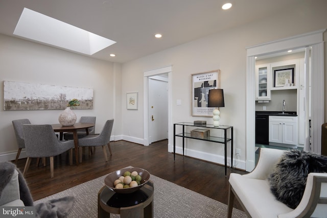 living room featuring dark wood-type flooring and indoor wet bar