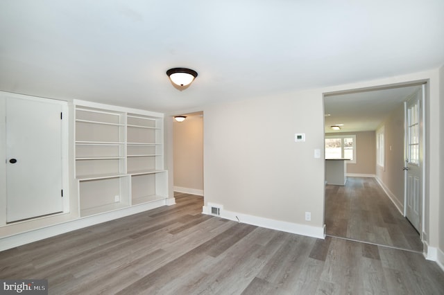 empty room featuring wood-type flooring