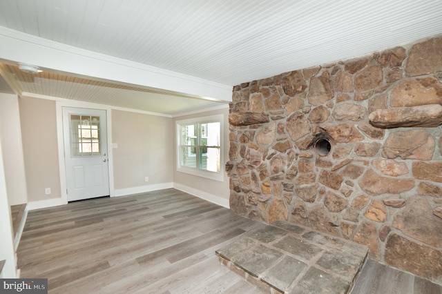 entrance foyer featuring hardwood / wood-style flooring and crown molding