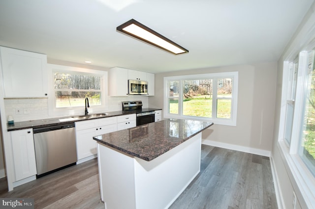 kitchen featuring white cabinetry, sink, and appliances with stainless steel finishes