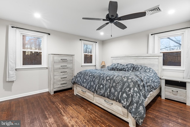 bedroom with ceiling fan and dark hardwood / wood-style flooring