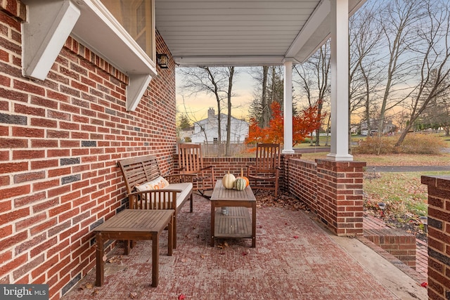 patio terrace at dusk featuring outdoor lounge area