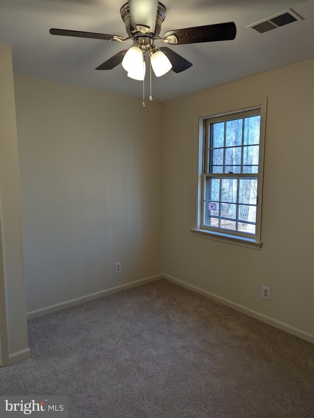 carpeted empty room with ceiling fan