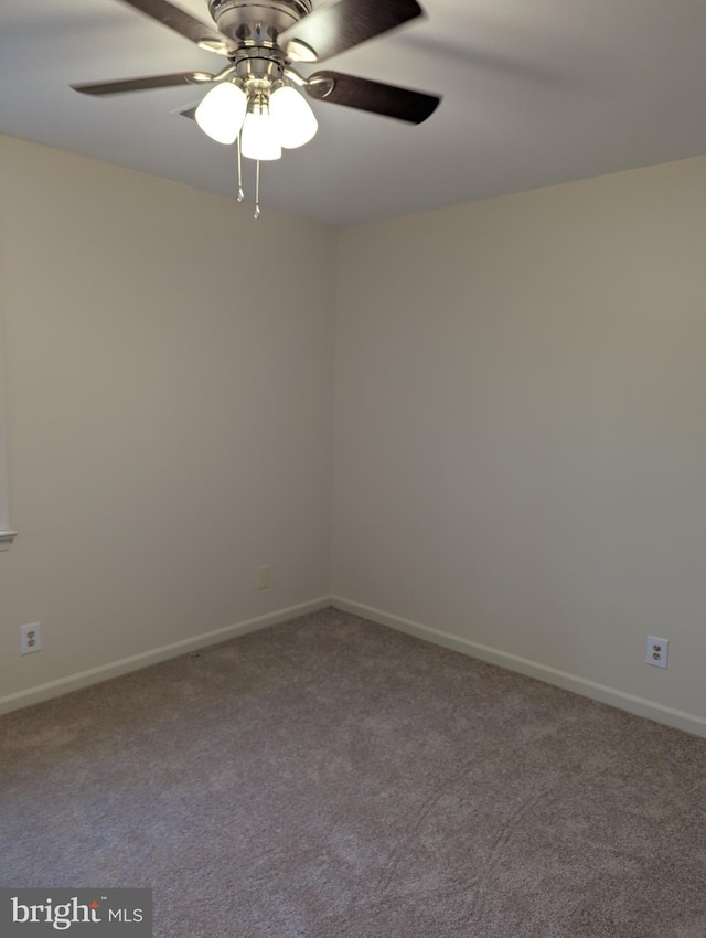 carpeted empty room with ceiling fan