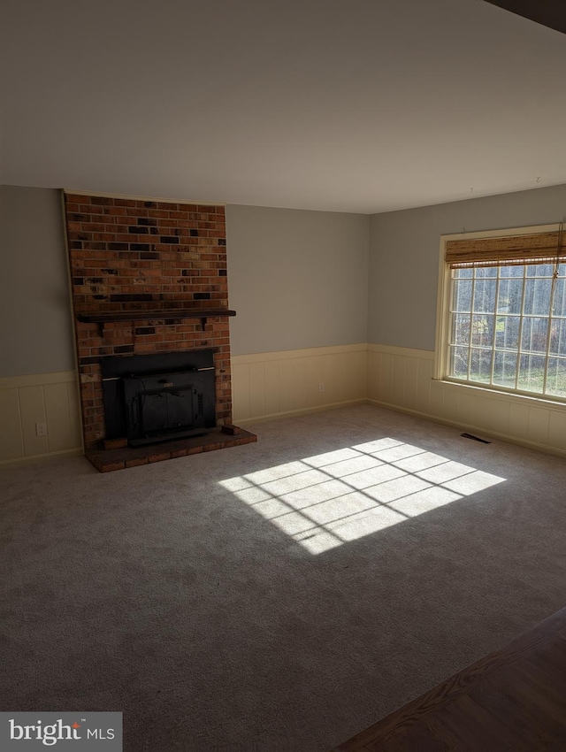 unfurnished living room featuring carpet floors