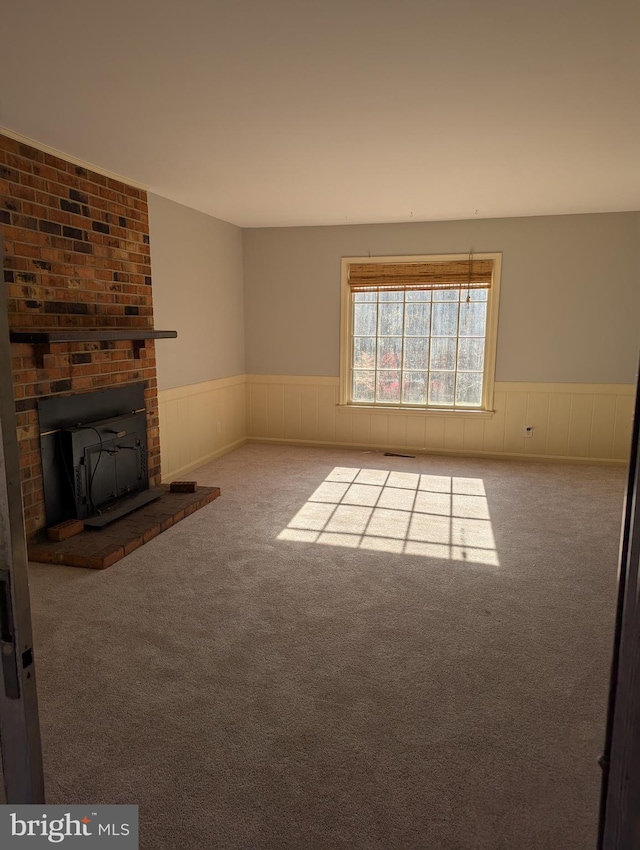 unfurnished living room with carpet