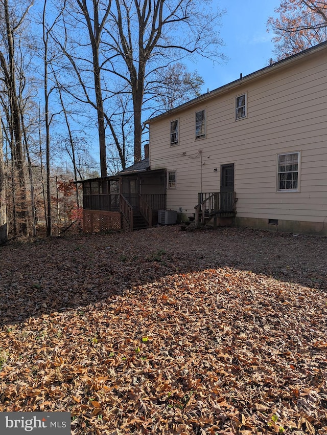 back of house with cooling unit