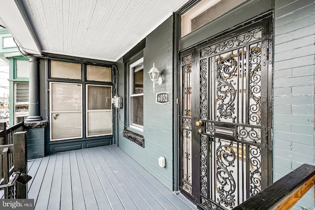 doorway to property featuring a porch