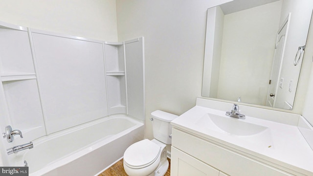 full bathroom featuring hardwood / wood-style flooring, toilet, vanity, and tub / shower combination