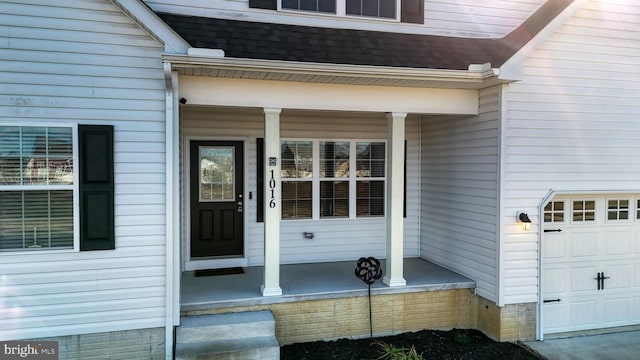 entrance to property featuring a porch