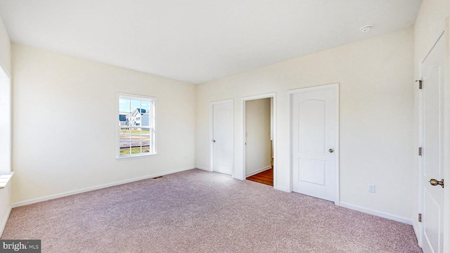 unfurnished bedroom with carpet