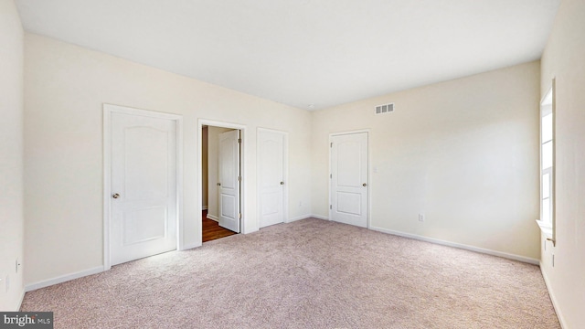 unfurnished bedroom with carpet floors