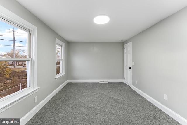 unfurnished room with carpet flooring