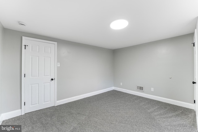 727 Clayton, New Castle, DE 19720 - empty room with dark carpet, baseboards, and a smoke detector