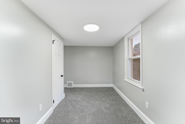 empty room with carpet flooring