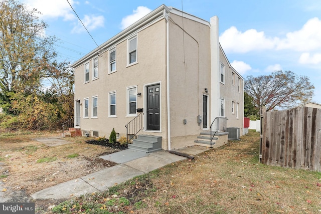 727 Clayton, New Castle, DE 19720 - rear view of house featuring central AC and stucco siding
