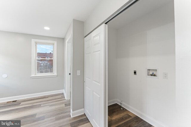 727 Clayton, New Castle, DE 19720 - laundry room with hookup for an electric dryer, hookup for a washing machine, wood finished floors, baseboards, and recessed lighting