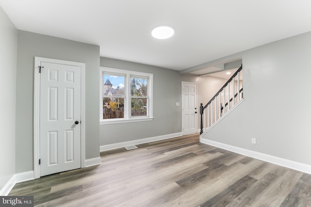 727 Clayton, New Castle, DE 19720 - foyer entrance featuring wood finished floors, baseboards, and stairway