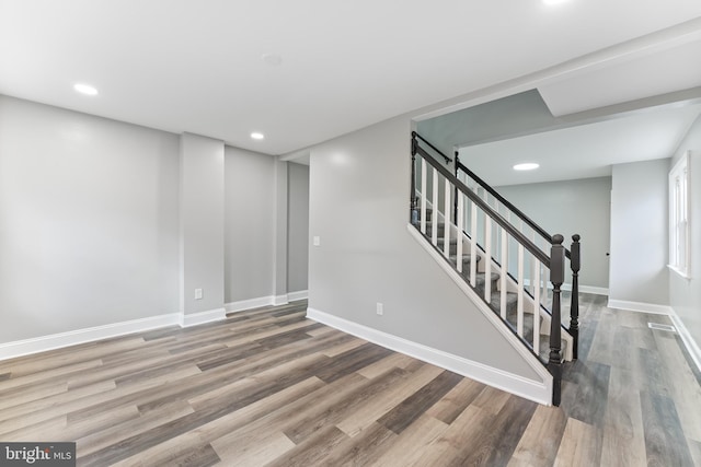 727 Clayton, New Castle, DE 19720 - basement featuring wood finished floors, baseboards, stairway, and recessed lighting