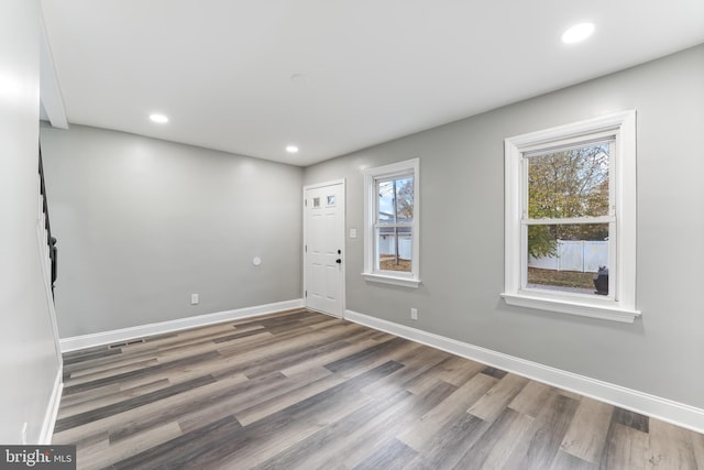 foyer entrance with hardwood / wood-style floors