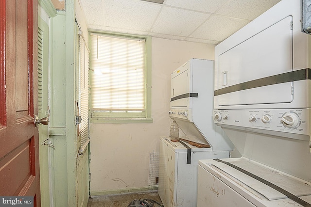 laundry room featuring stacked washer and clothes dryer