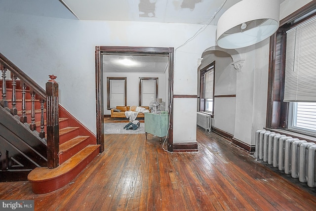 interior space featuring radiator and dark hardwood / wood-style flooring