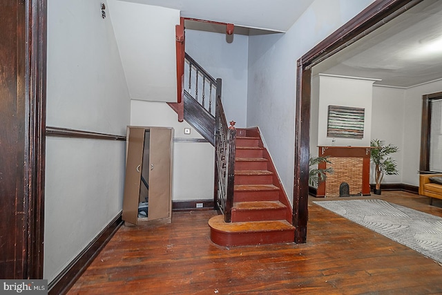 stairs with hardwood / wood-style floors