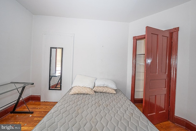 bedroom with wood-type flooring