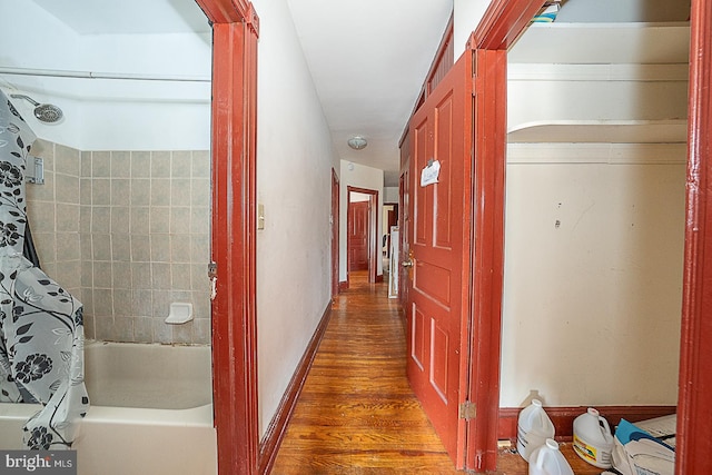 corridor with dark wood-type flooring