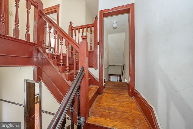 stairway featuring hardwood / wood-style floors