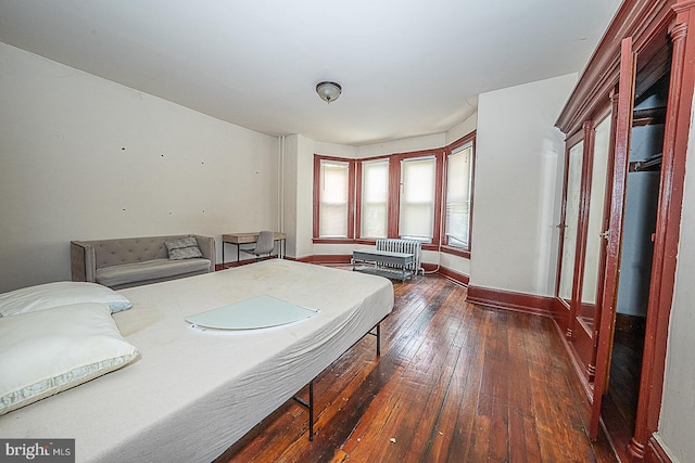 bedroom featuring dark wood-type flooring