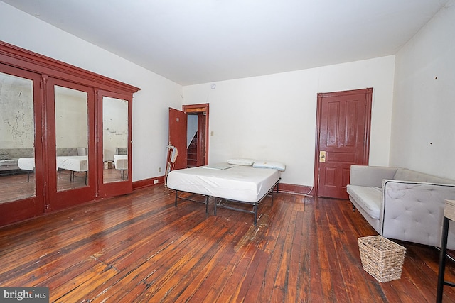 bedroom featuring dark wood-type flooring