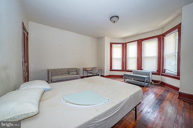 bedroom featuring dark hardwood / wood-style floors