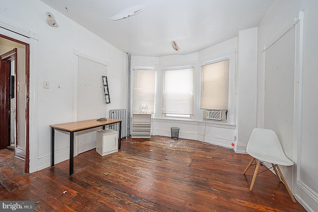 interior space with cooling unit and dark wood-type flooring