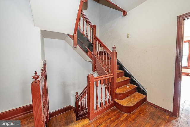 stairs with wood-type flooring