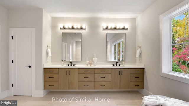 bathroom featuring tile patterned floors and vanity