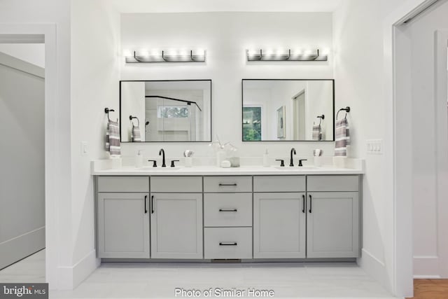 8202 Mockingbird Dr, Annandale, VA 22003 - bathroom with a sink, baseboards, a shower stall, and double vanity