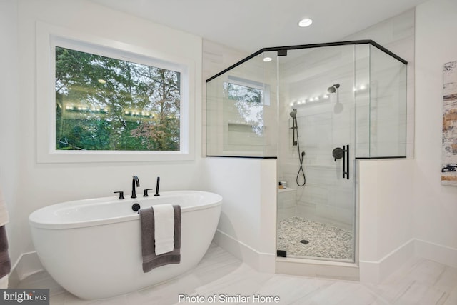 8202 Mockingbird Dr, Annandale, VA 22003 - bathroom with recessed lighting, baseboards, a freestanding bath, and a stall shower