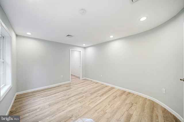 empty room with light hardwood / wood-style floors