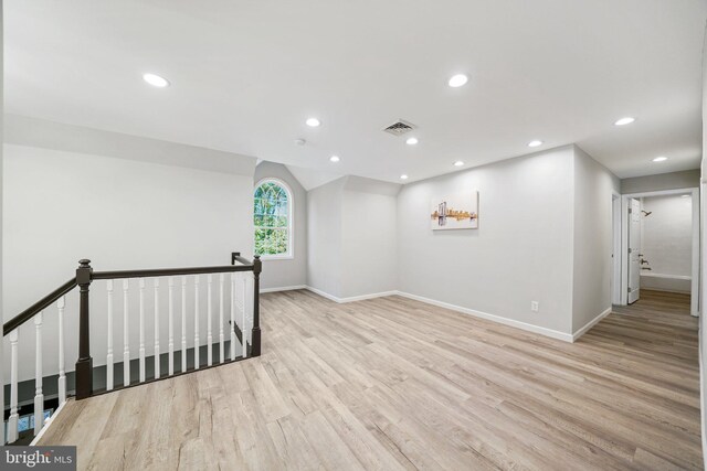 spare room featuring light hardwood / wood-style floors