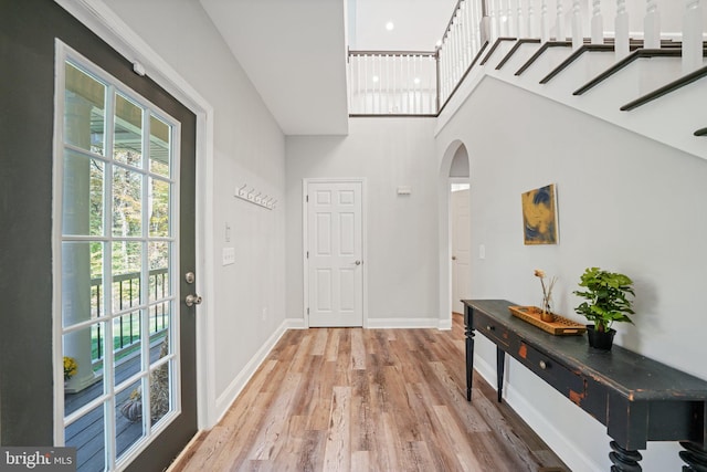 entryway with hardwood / wood-style flooring