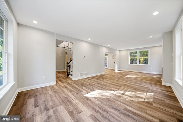 unfurnished living room featuring light hardwood / wood-style flooring