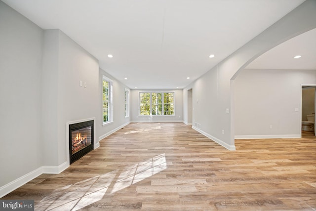 unfurnished living room with light wood-type flooring