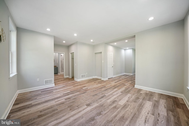 spare room featuring light hardwood / wood-style flooring