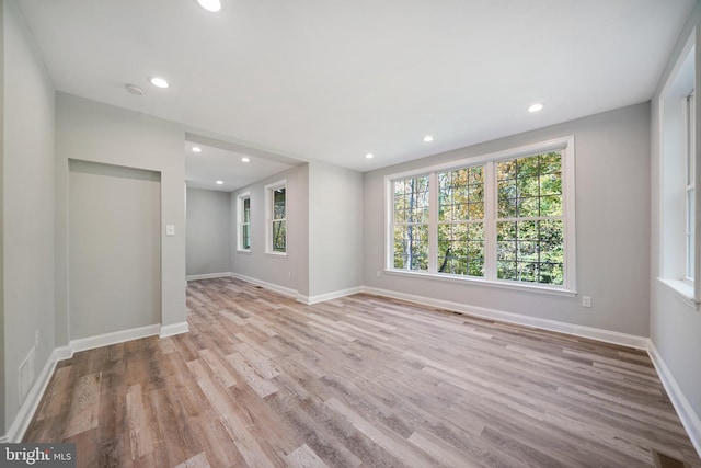 spare room with light wood-type flooring