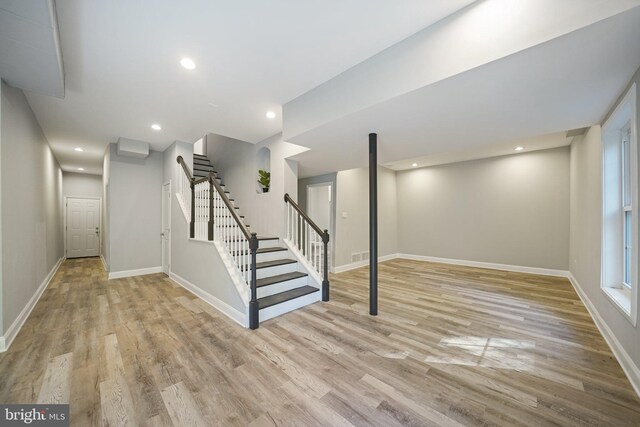 basement featuring light wood-type flooring