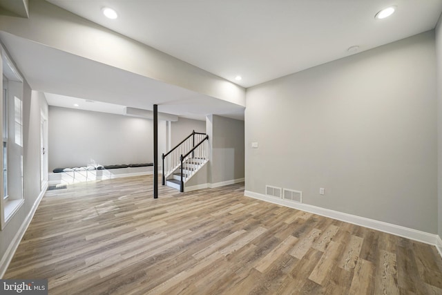 basement featuring light wood-type flooring