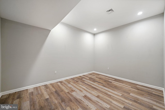 spare room with light hardwood / wood-style flooring